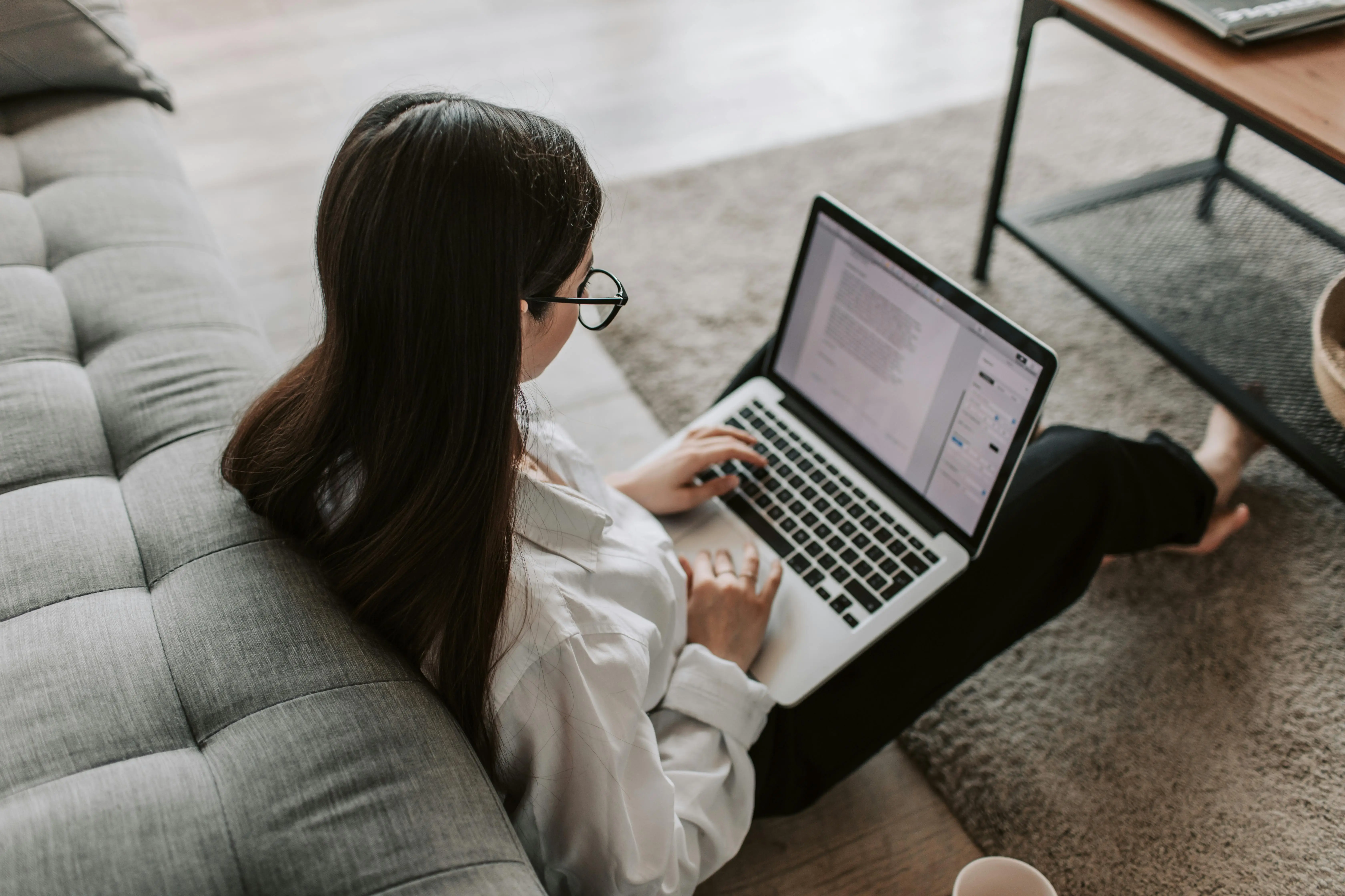 Accountant using laptop and financial documents