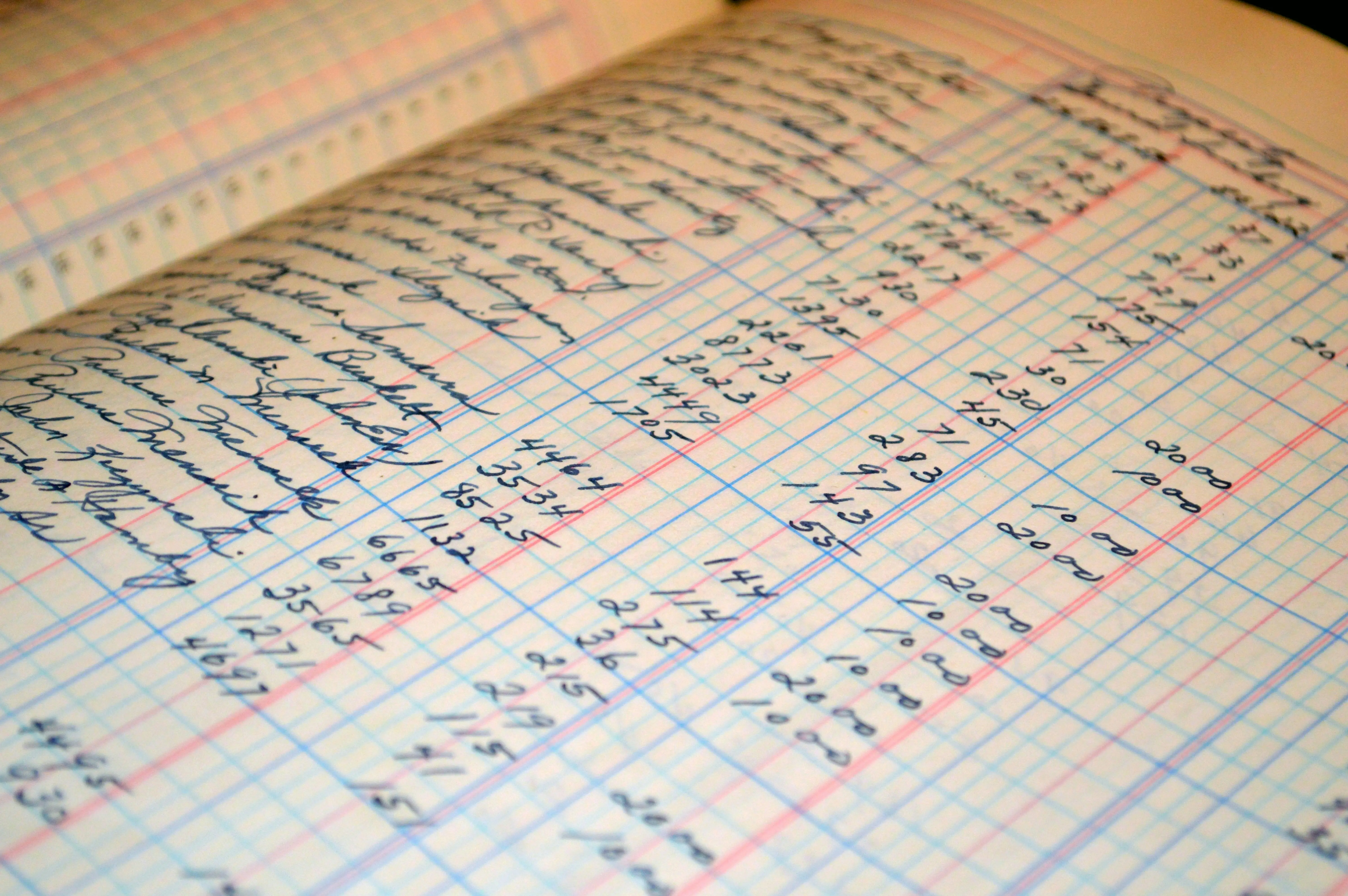Accountant using laptop and financial documents